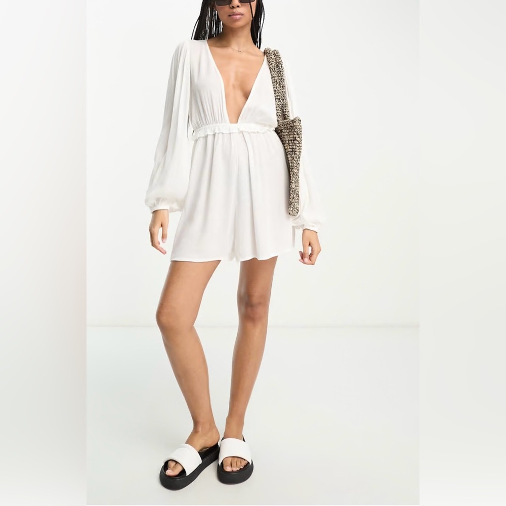 Long sleeve deep plunge beach romper in sheer white